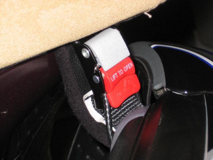 I pass the strap through the loop, then pinch the cable together and push it through the latch leaving the end of the loop sticking out of the latch.
