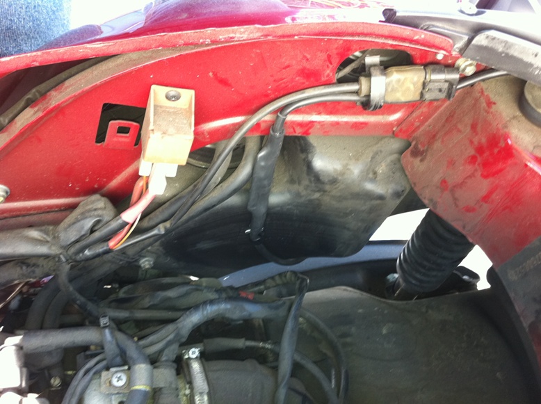 View down thru the top, showing where I routed the cable.  Outside of the gas tank.  I used two of the clips supplied to hold it in place.