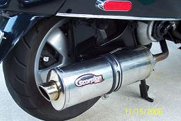 Once the two nuts are bolted onto the exhaust opening, this is how the pipe will sit.  The clamp over the pipe is also supplied and needs to be attached to the frame to hold the muffler from moving around.