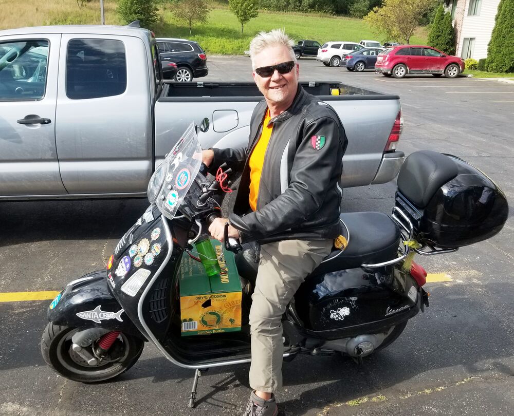 Wisconscoot a couple years back. Beer run to get some Spotted Cow for a friend back home after a day's riding.