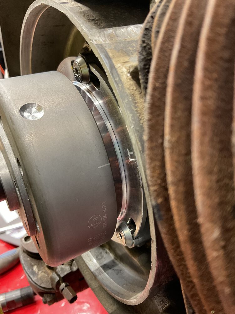 Step 10 - rotate rotor and wheel counterclockwise line up the line on rotor to T mark on stator plate.