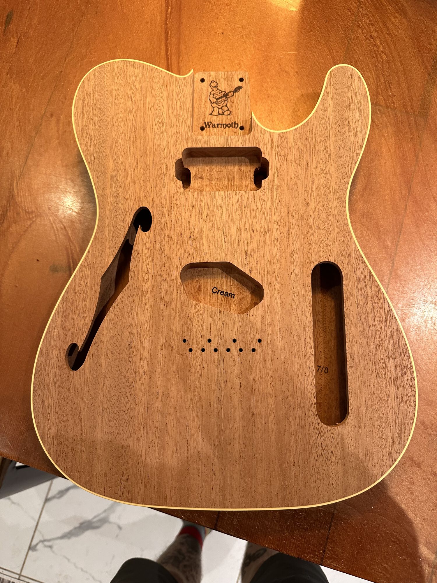 The pick guard covers the humbucker hole so no one would ever know it's there until I use it.