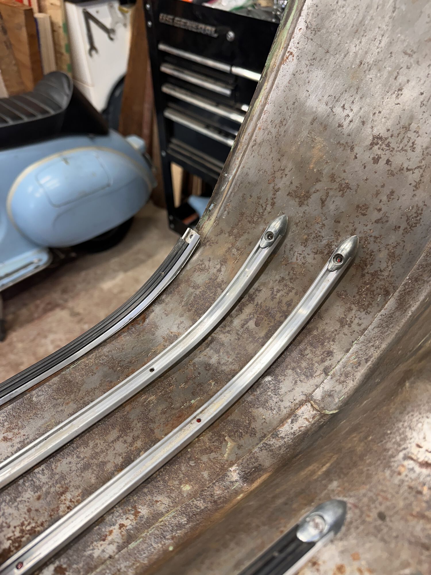 First remove the rubber and screws.