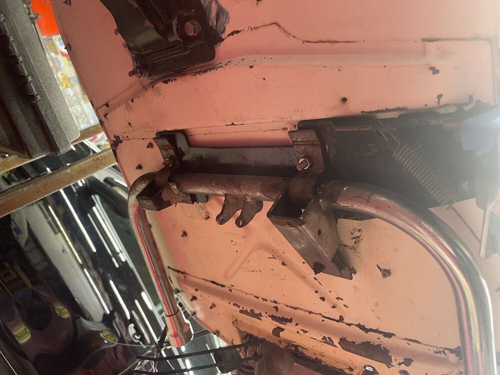 The sidestand goes against the floorboard, then the centersand.