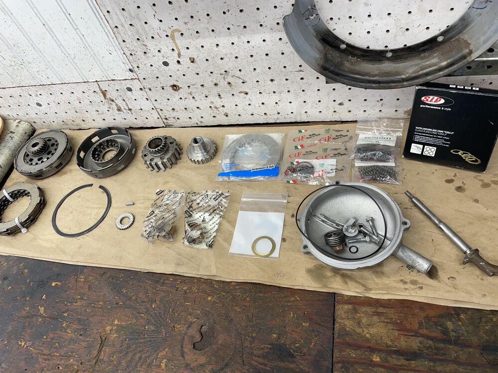 Pieces of this puzzle.  I'm using SIP CR80 style plates, SIP steel plates, Piaggio brass bushings, 8 L springs + 8 XL springs, heavy duty SIP clip. All new o-rings for the cover.