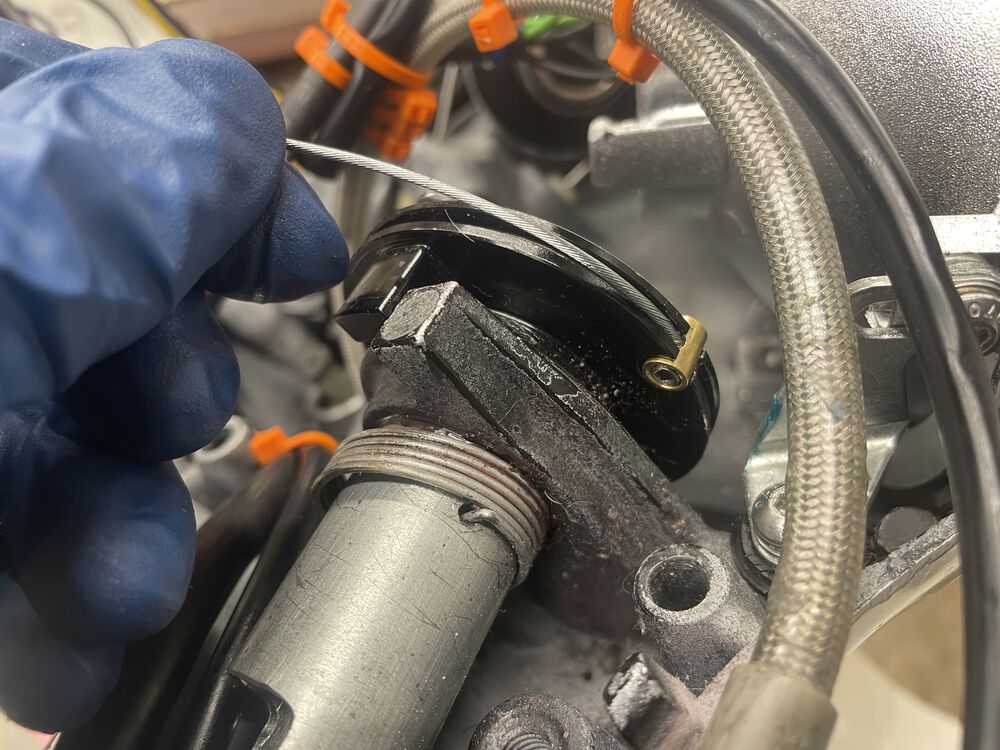 throttle cable pulled bottom to top, pinch bolt in place. makes initial adjustment easy. cable trimmed to length after test fit of carb operation.