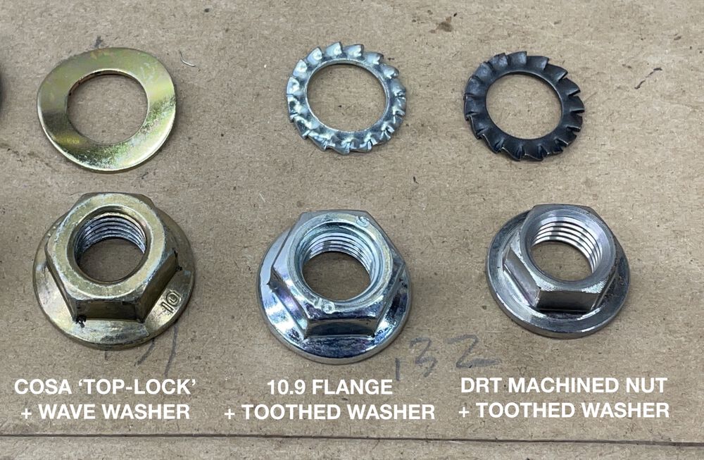 As received it had an original style COSA nut & wave washer. These are a 'distorted-top' style nut. I have that style new, and a DRT machined nut + star washer.  I chose the DRT nut.  I'm not a fan of distorted threads