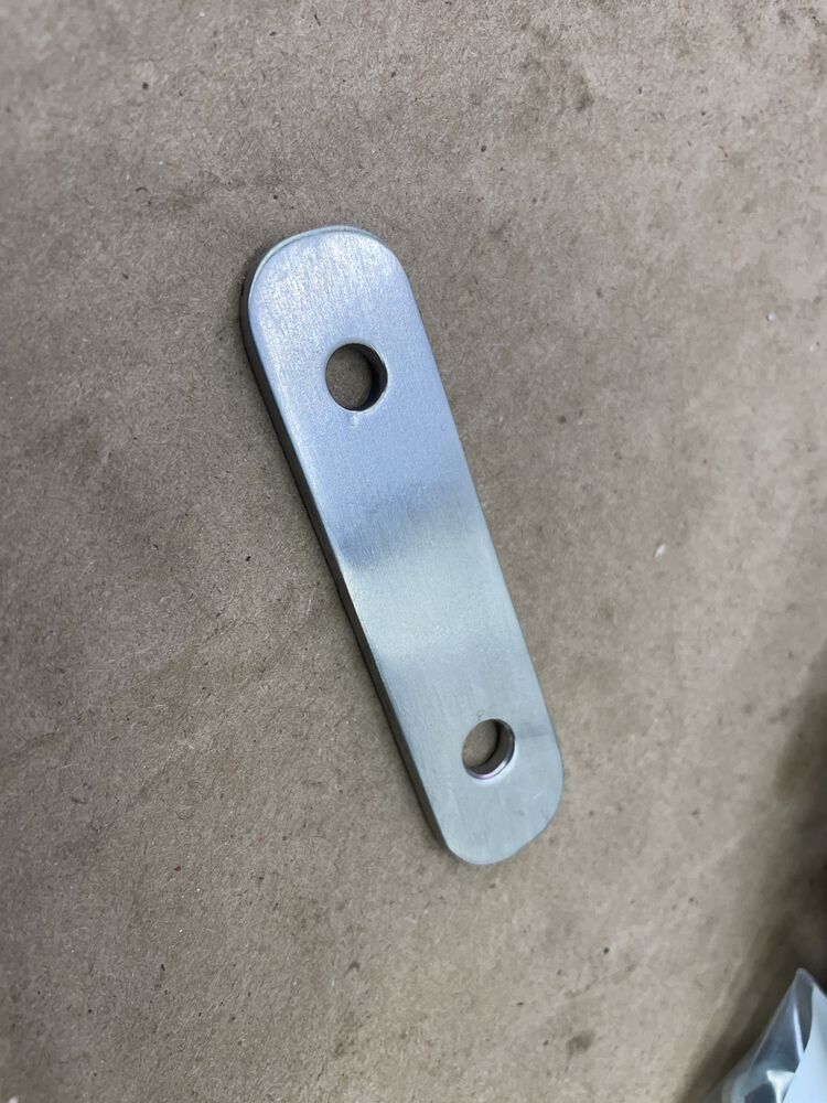 Trim plate final form. Rounded, smoothed, champhered, and finish sanded.