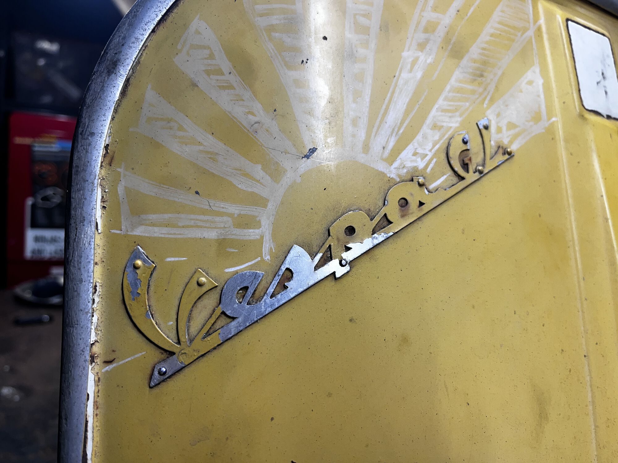 Paint overspray on the front legshield badge.