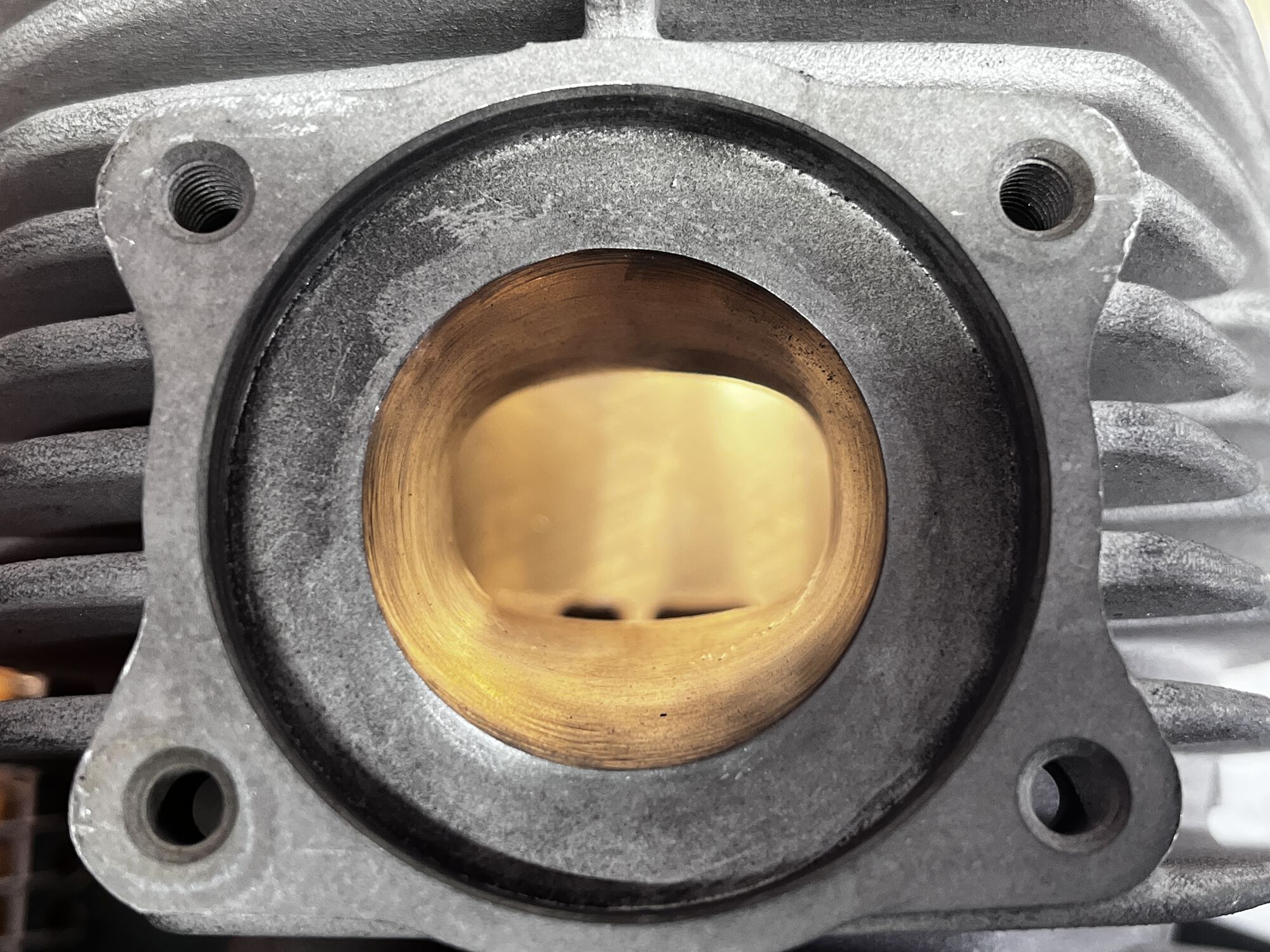 Cylinder exhaust outlet, opened to match manifold, and the entire port polished