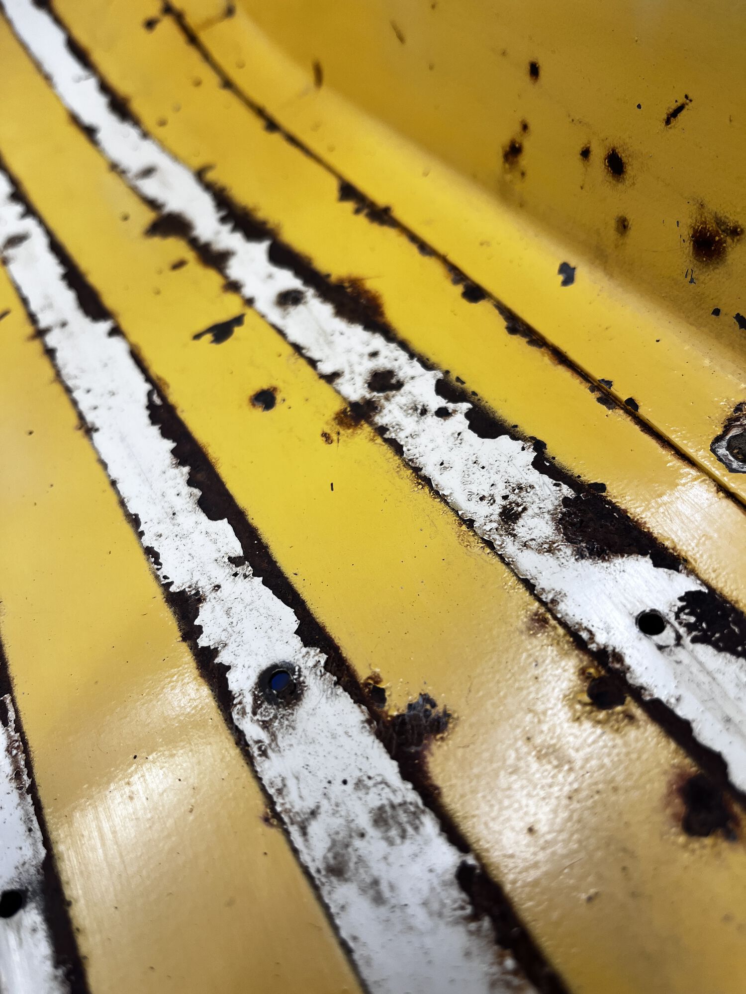 Up close view of floorboard on left side.