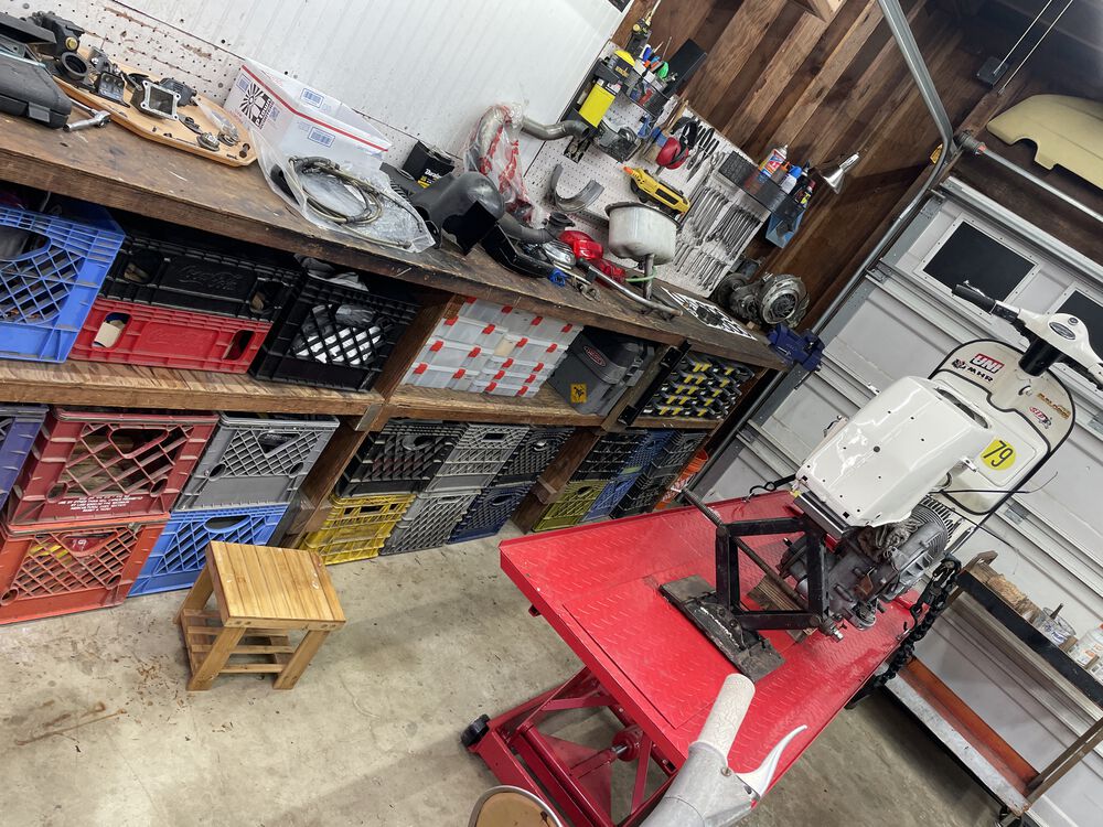 View of the work station, and bench with parts removed. Also the jack-lift I made for scooter jobs like this.
