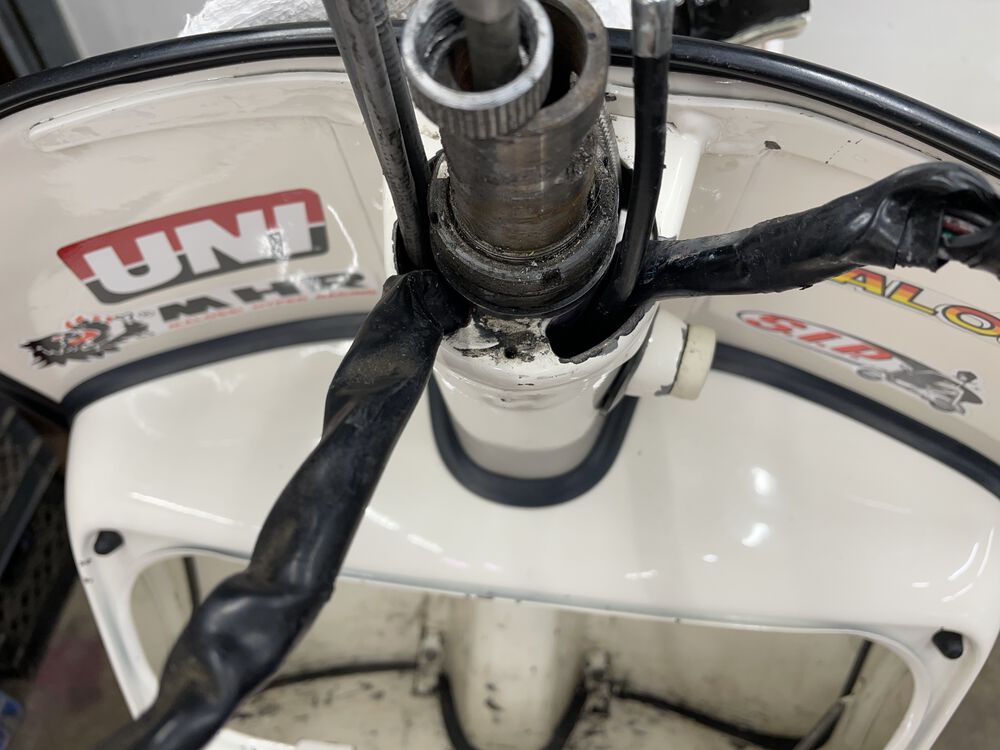 headset removed to see where the wires and cables are. The wire bundle on the left should be on the right, behind the steering column lock