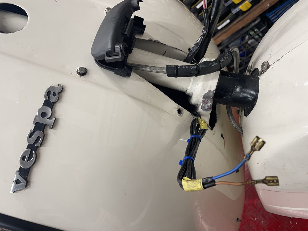 I pulled those indicator leads back out and cleaned it up. I ran a fresh set of brown & blue wire from these 2 near the horn, up to the headset; which will then connect to the bar end lights.