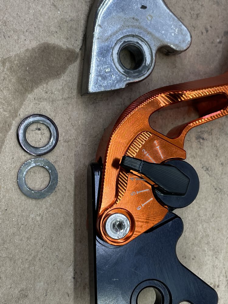 Had to make an adjustment to the spacer washers that sit on top & bottom of the lever on MC. The recessed portion where the washer sits on the new lever is a smaller diameter than the original. I ground down the outer diameter of the washers to fit.