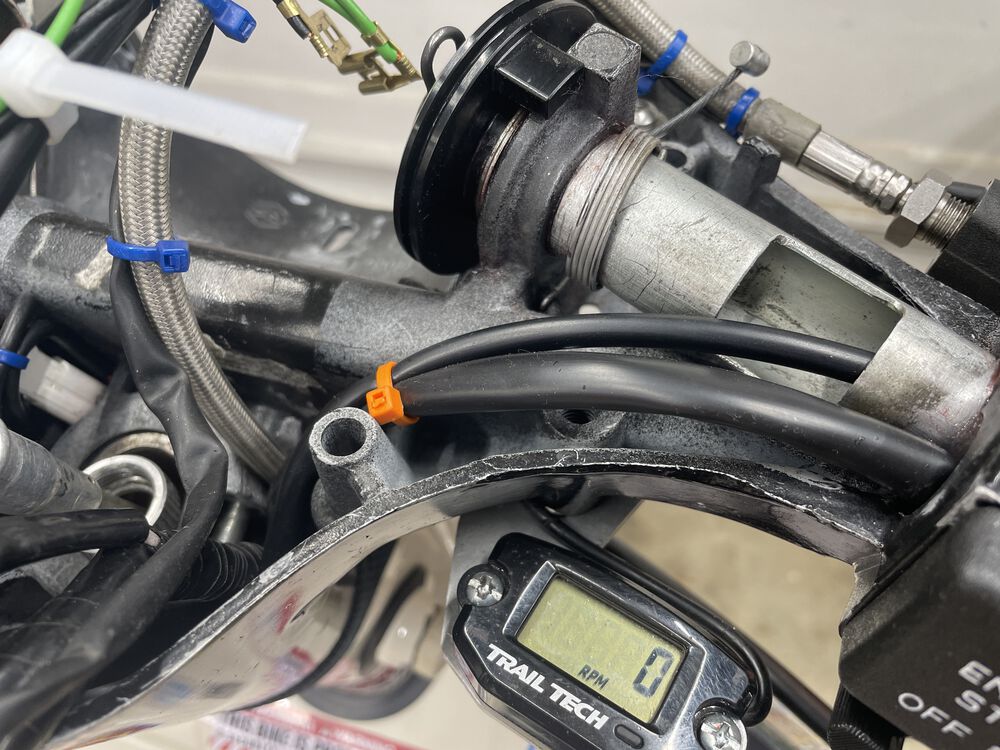 throttle side wire ran thru the tube along with the throttle cable. there is plenty of room without binding.