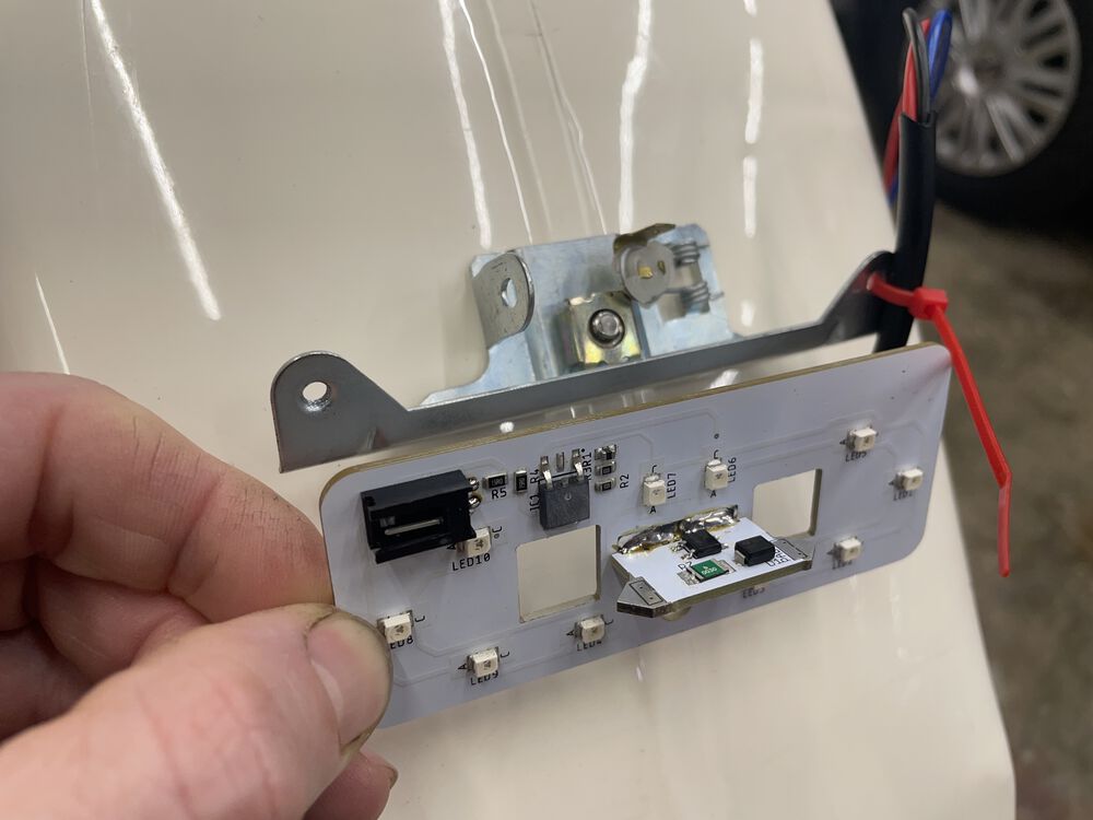 Fits in place of the festoon bulb for the tail light. Brake light connection is the black square pin connector top left.