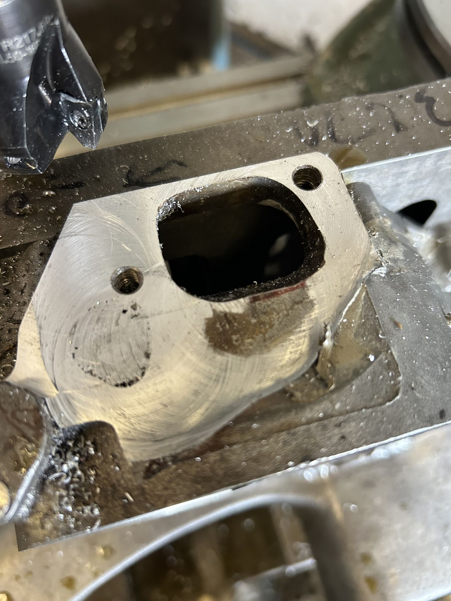 after a few light passes with cutter. You can see the bit of voids from welding, these are just on surface. Also notice the low spot near the opening