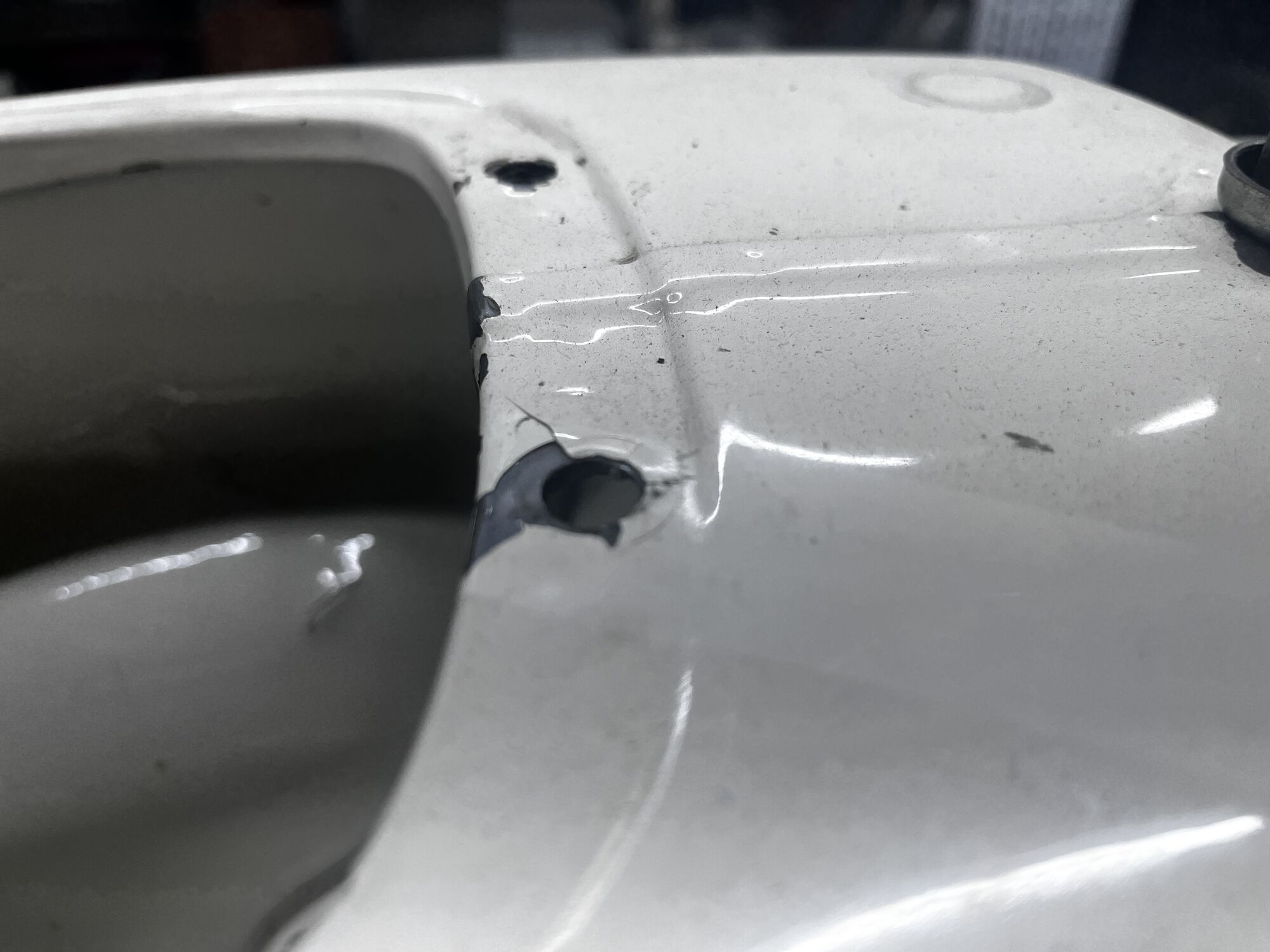 Busted out rear fuel tank mounting bolt hole.
