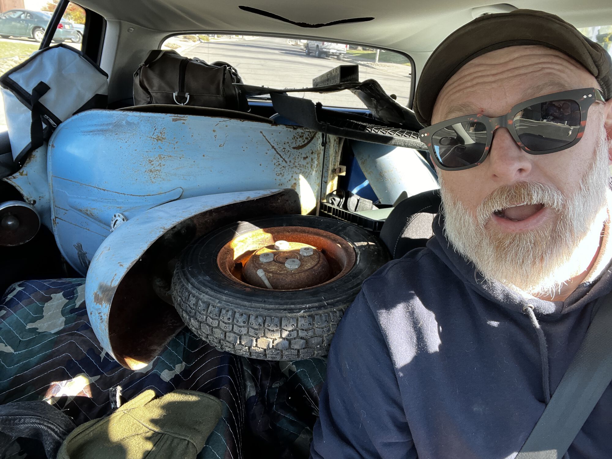 Look behind you, theres another one of those weird scootahs in the car!