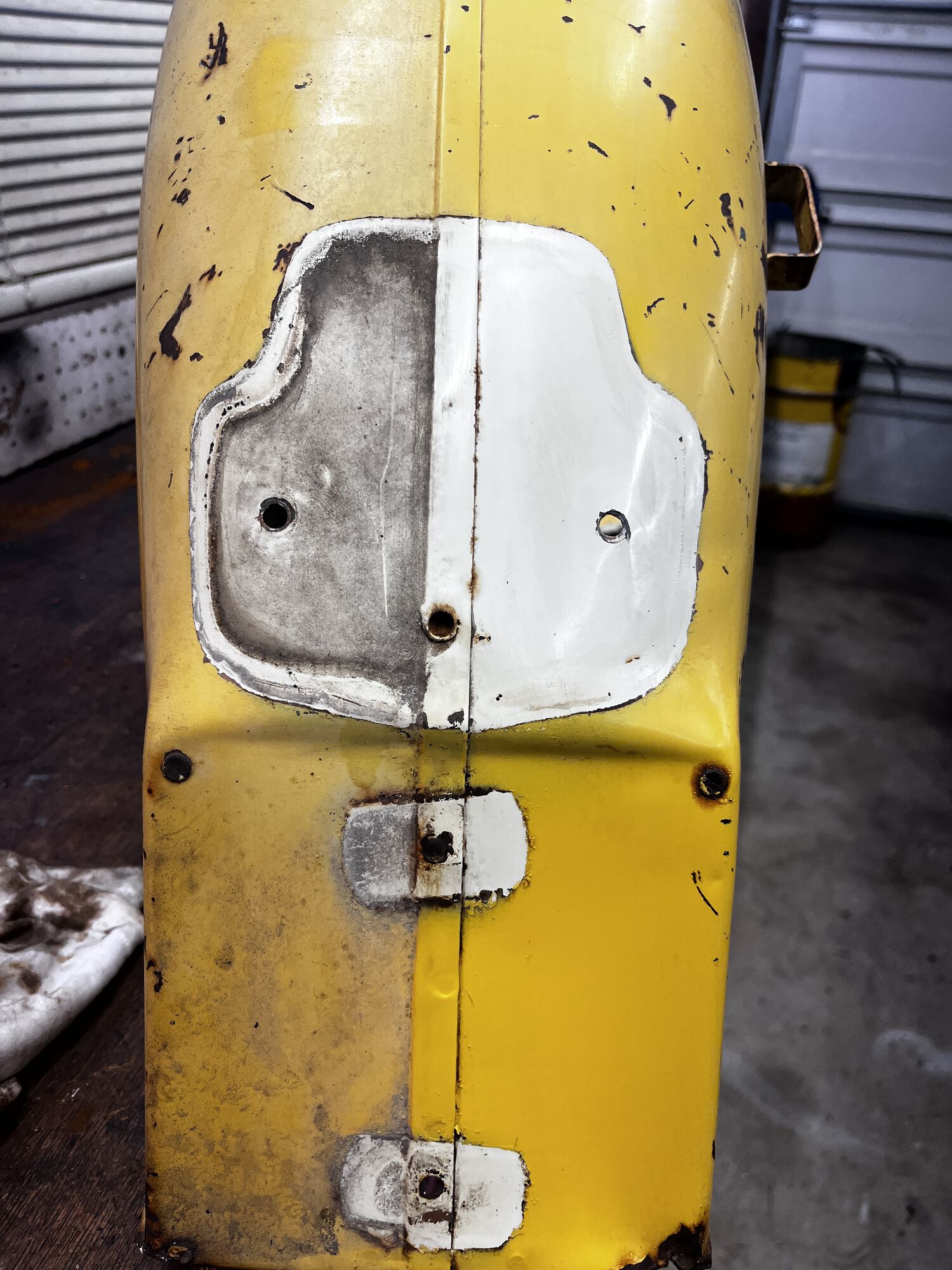 rear view after scrubbing half the frame. Looks a little better. Notice the original white paint under the taillight.