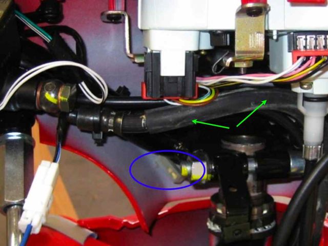 Here's the basic lay of the land when you get the handlebar cover off.  The unused connector is hard to spot (blue circle).  I have a close up in the next photo, but this photo gives an idea of where to find it.