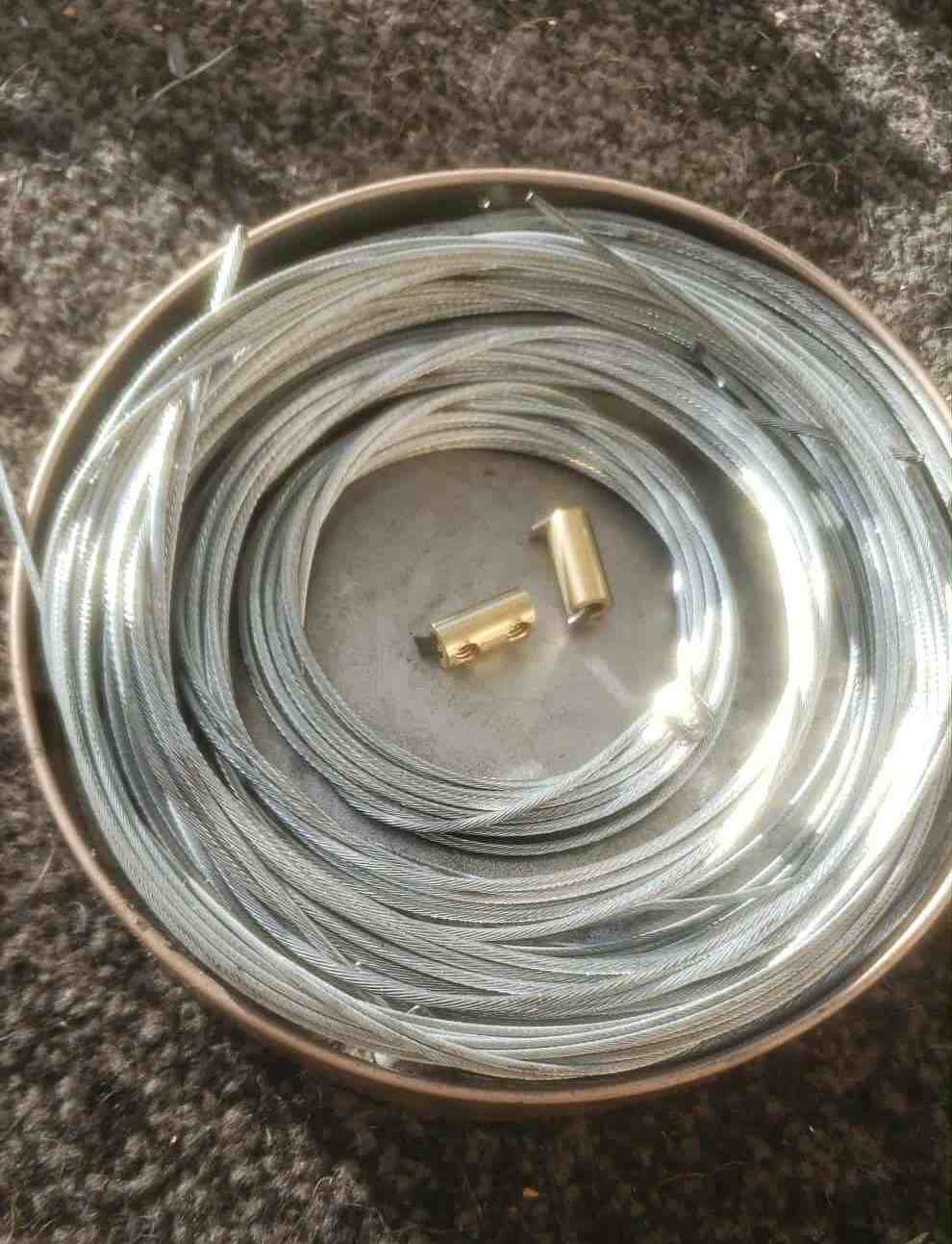 Cables in an angle grinder blade tin. Handy to keep them together and stop unravelling. Plus my new No-Krush™ cable trunnions!