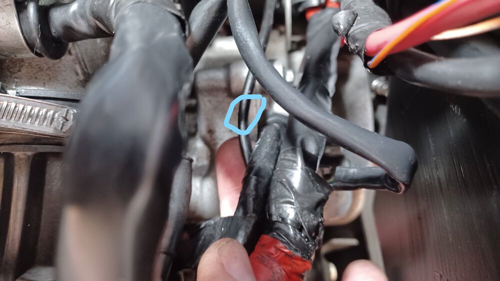 What's this? the cable runs down under the engine bay - next pic.