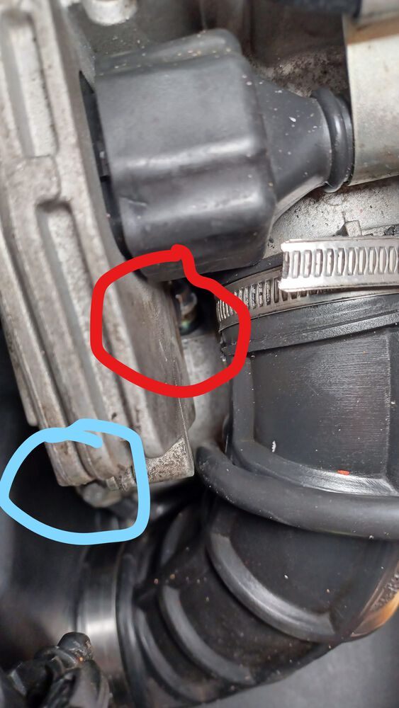 Positive terminal in red, after wiggling the rubber boot off of the stacked nuts.