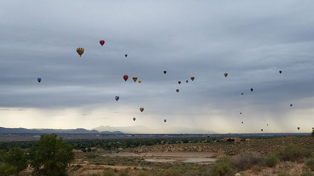Storm in the background.  Pilot discretion day.  Most that flew ended up in Corrales and Rio Rancho.