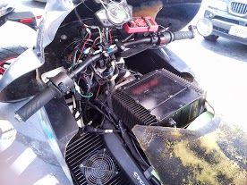 Up close. The seat looked like it would be horribly uncomfortable and those are chargers on the top and sides.