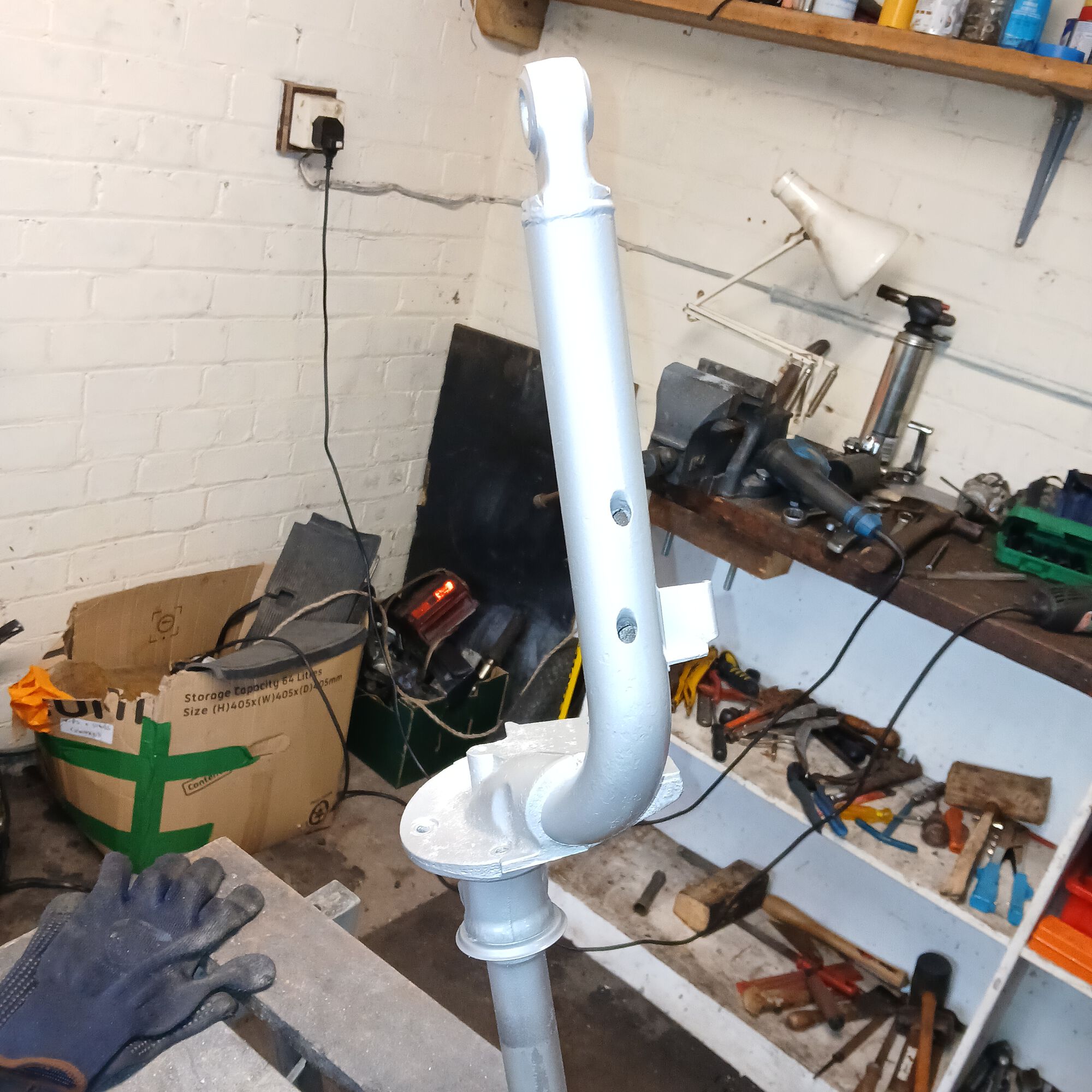 Fork leg in its first coat of paint