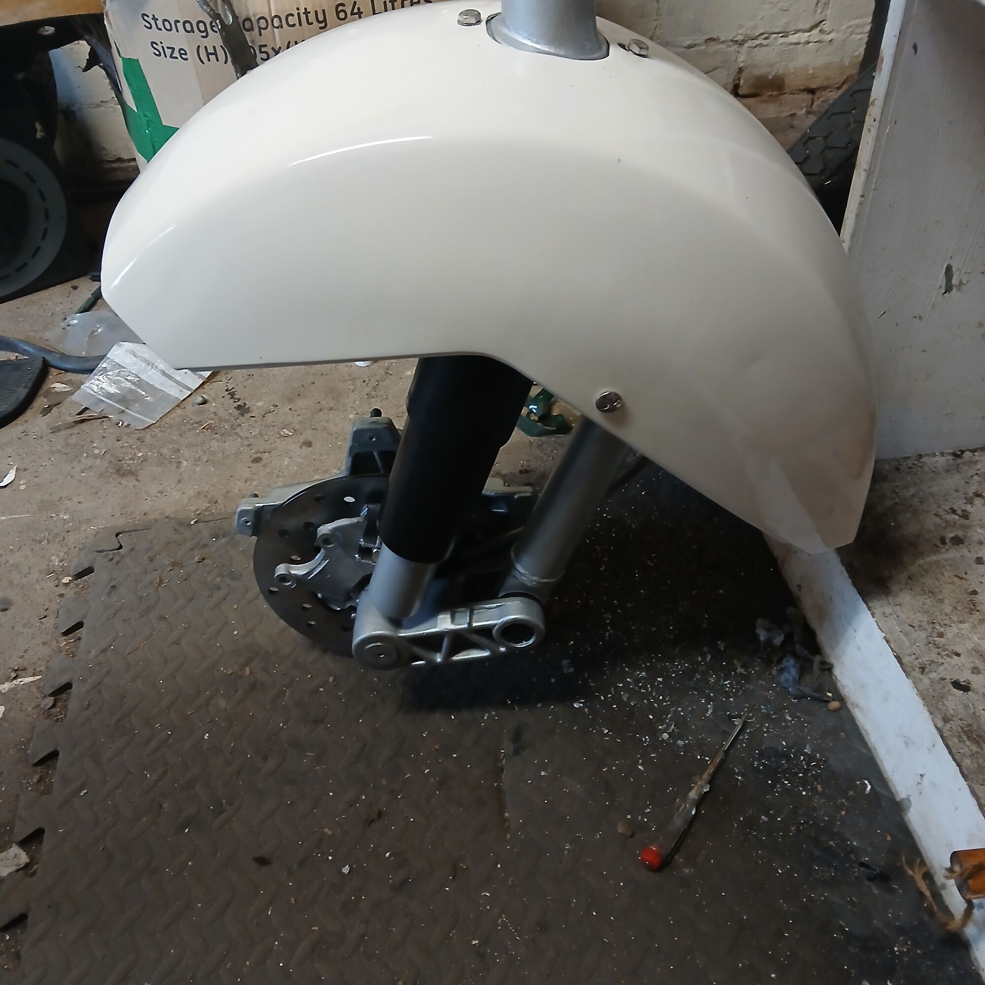 Front mudguard and thread the speedo cable through