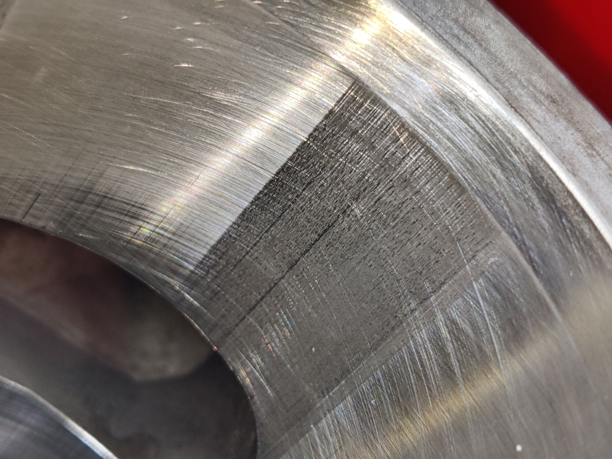 Lots of marks here;  I can very slightly feel where it begins and ends with my fingernail.