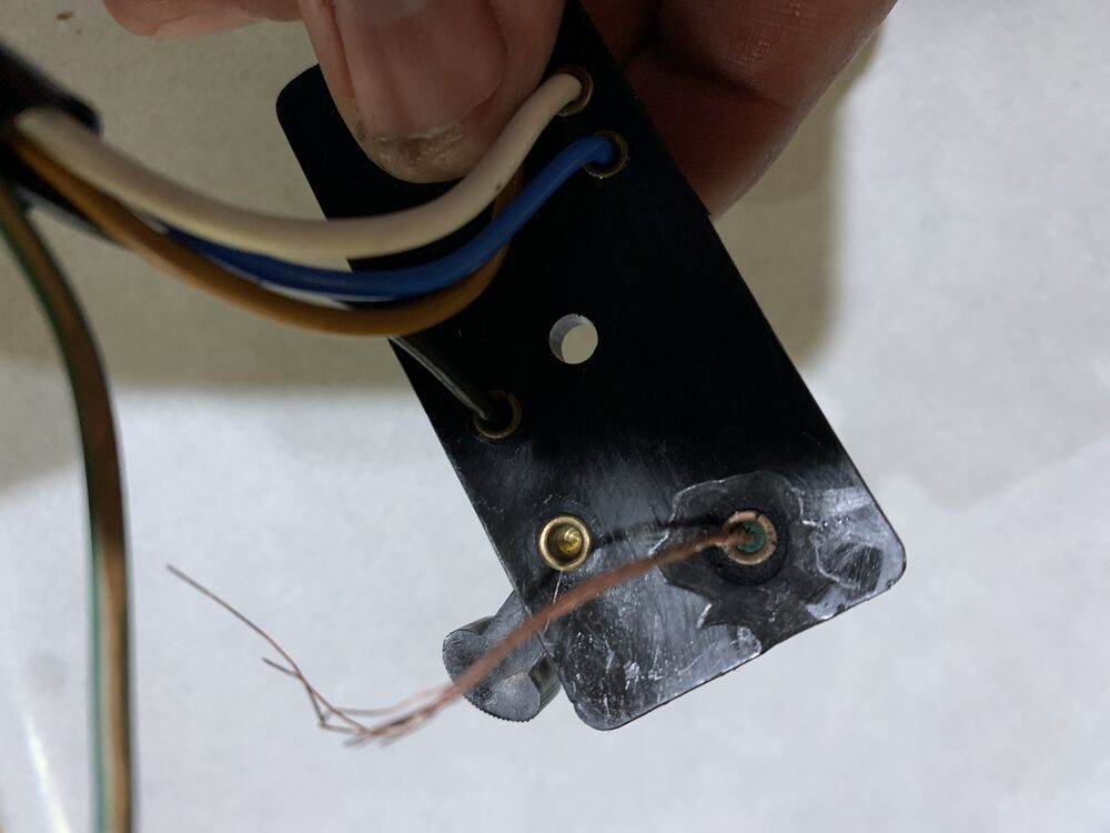 What is holding the wire in the connector?