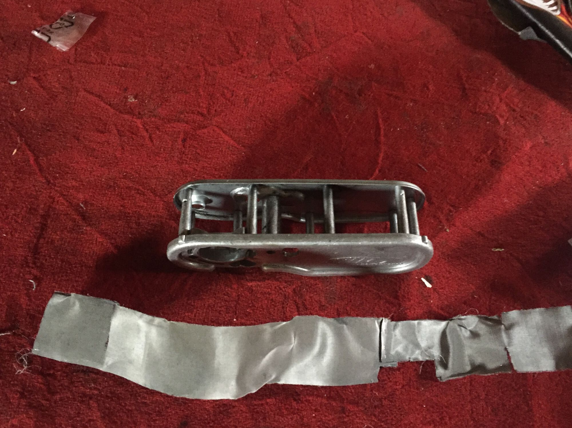 Fine metal mesh torn from normal use