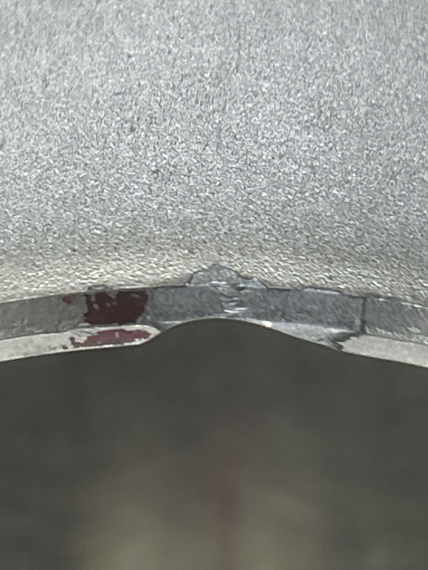 Chipped nikasil bottom edge of skirt