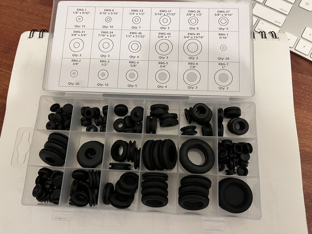 Hopefully three of these fit in the places where you can't find grommets