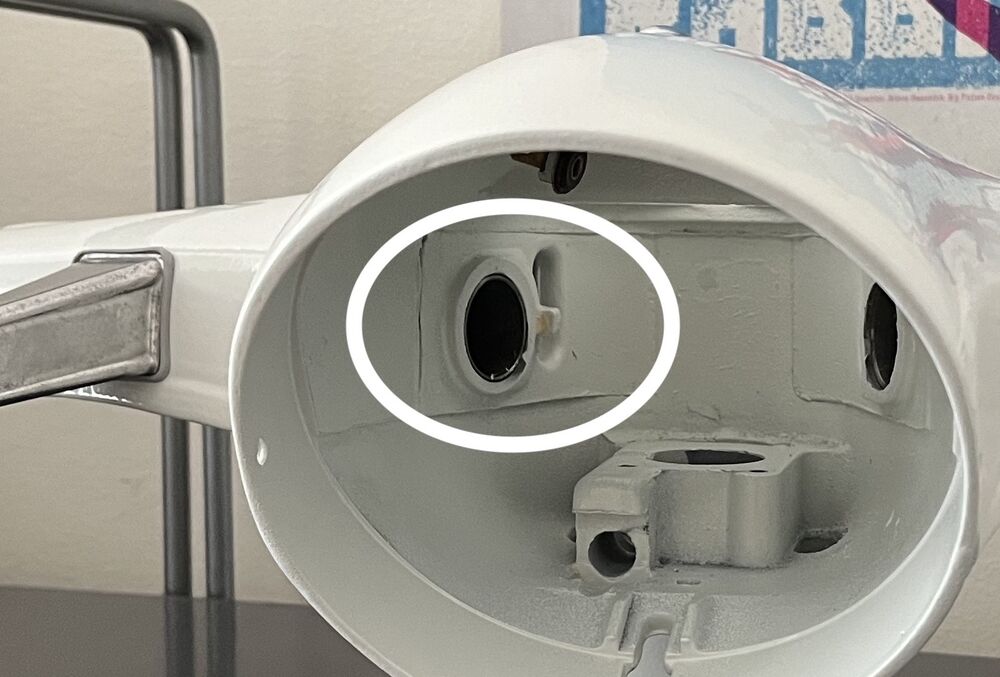 It might attach here to this tab, but would need a hole in the throttle tube drilled somewhere.