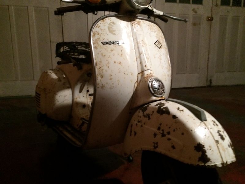 Modern Vespa : Rally with rusted frame channel.