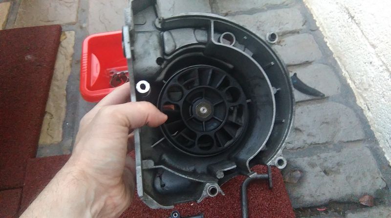 One of the trickier things on reassembly  is to match the holes in the black plastic disk here.....