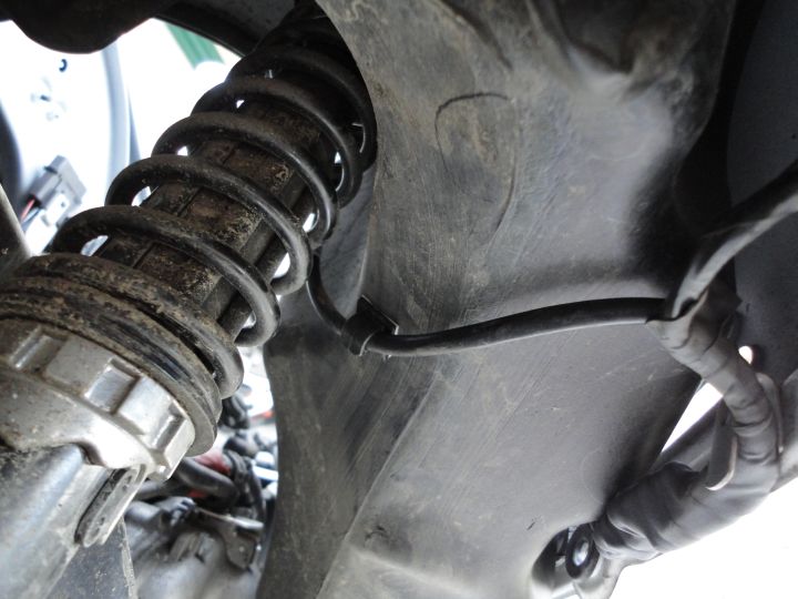 ...and the last clip can be used to keep it away from the suspension spring.
