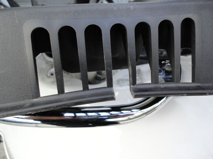 Using a sharp knife cut a slot in the cover-thingie, and refit all the bits you took off.  Job done!