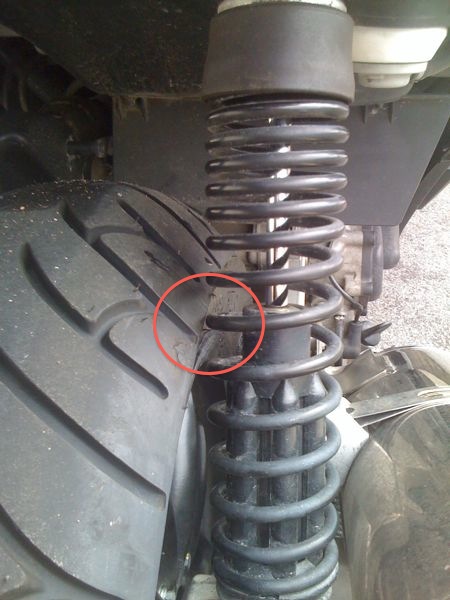 View of right shock and tire. Note close clearance that is highlighted.