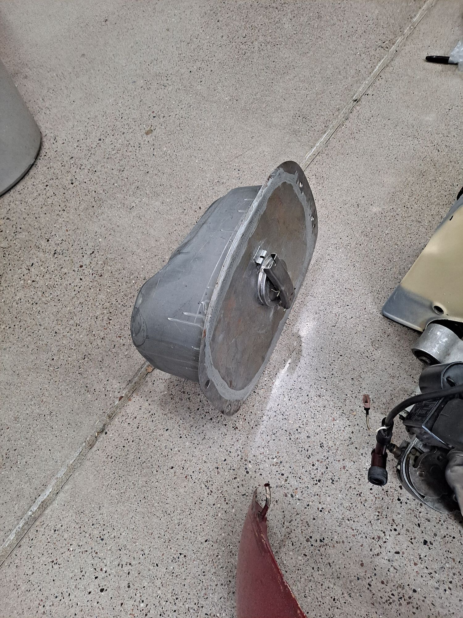 Shiny new tank.  The original one had been hacked up with a generic fuel gauge sender and my welding skills were no match for thin, abused steel.