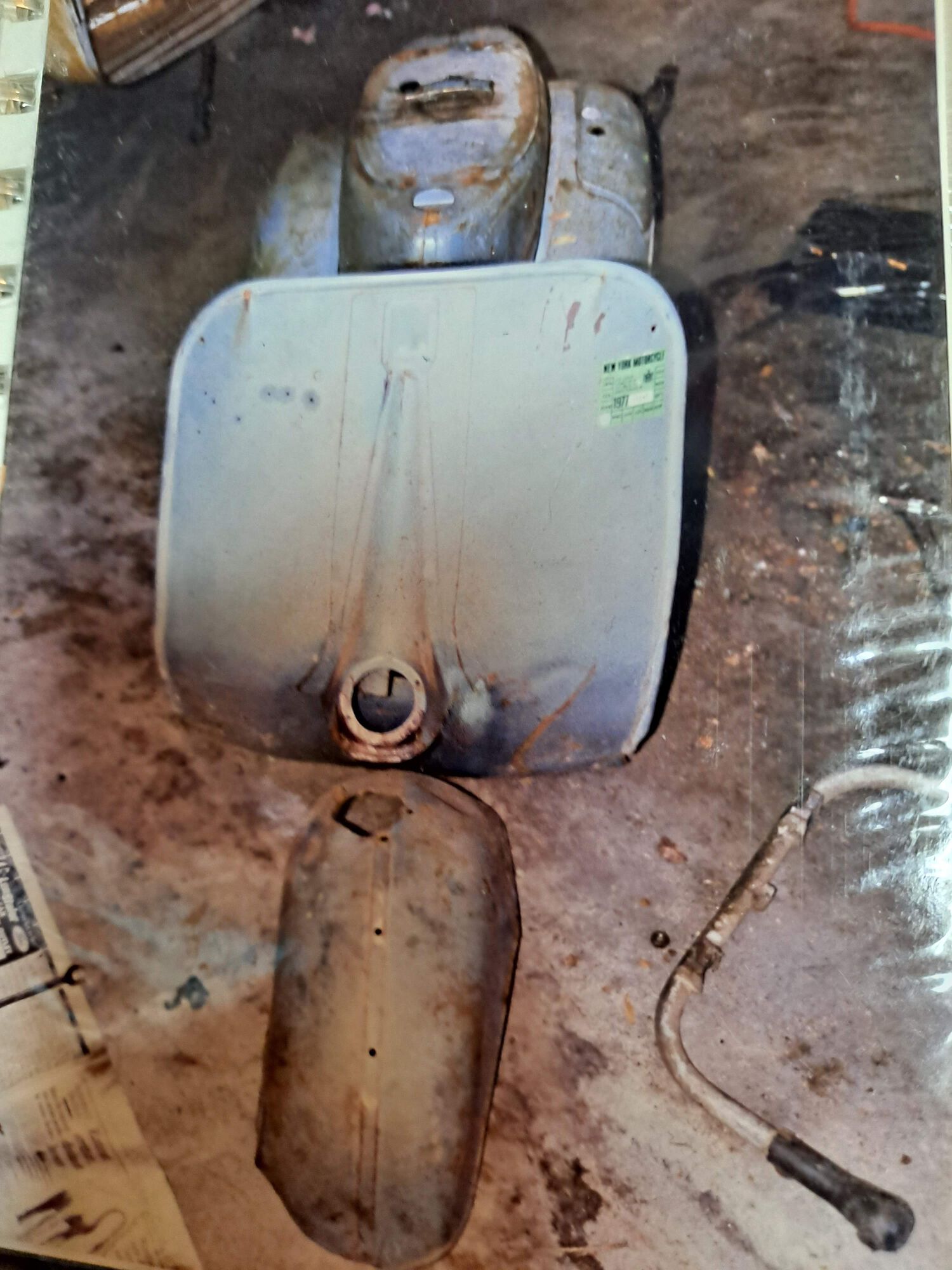 In the dank garage I was renting in college.  Seized motor out and the rest of the bike all dismantled. The VNB is just barely visible in the corner.