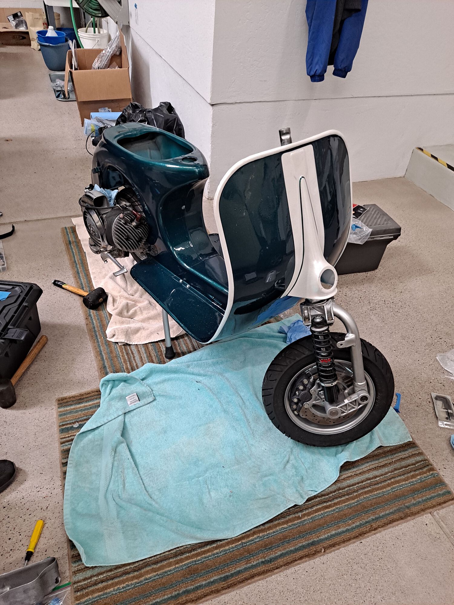 The lack of mudguard here shows we're working on something.  Basically, the painter took some liberties in making everything 2-tone except for a fully white mudguard that just didn't look right.  Dry fitting without it for now.