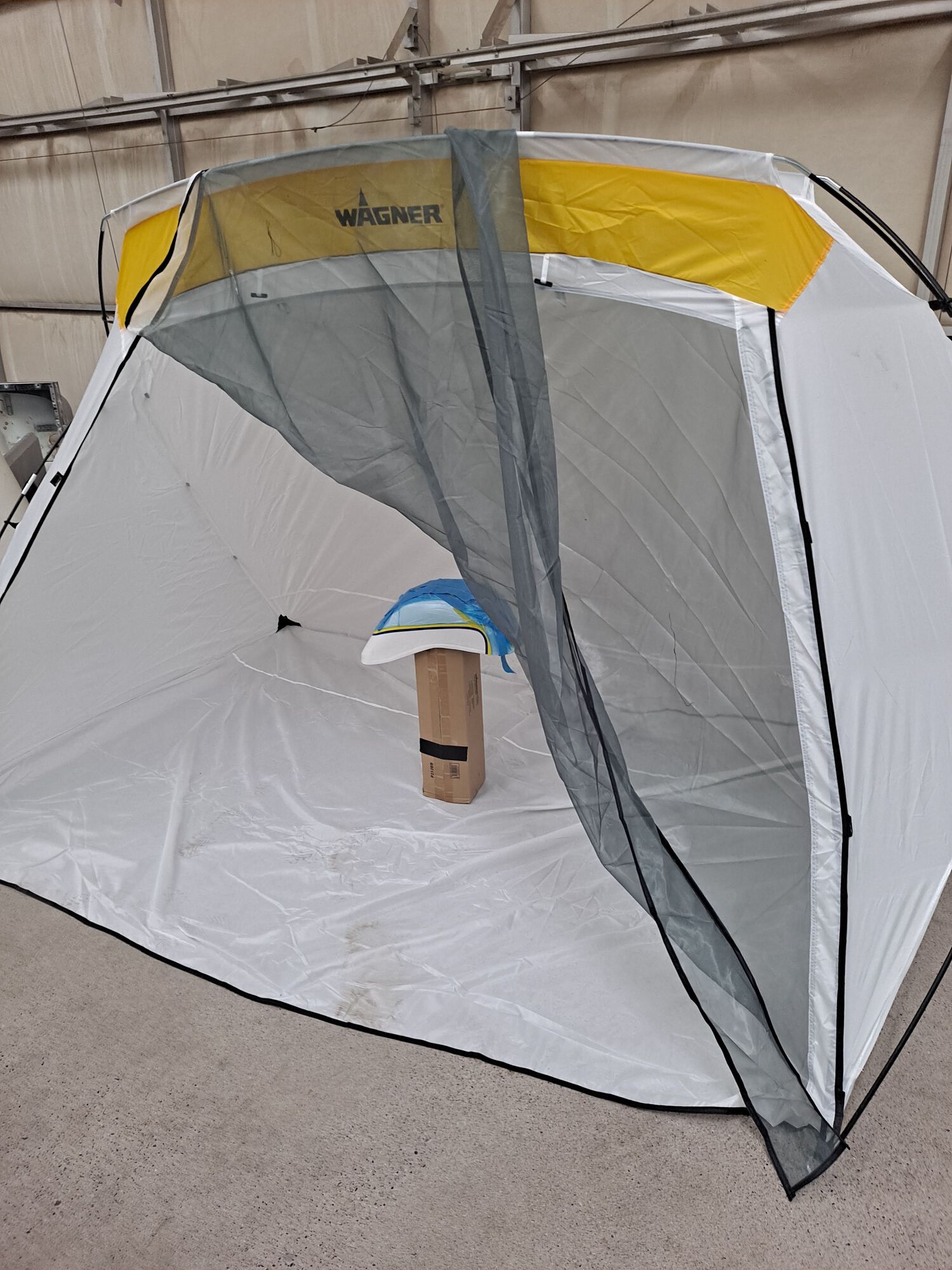 Time to fix the mudguard paint in a cheap paint tent.  Had to find a place that would mix up a near-perfect match since the original painter fell off the face of the earth and never gave me the codes or any touch-up paint.