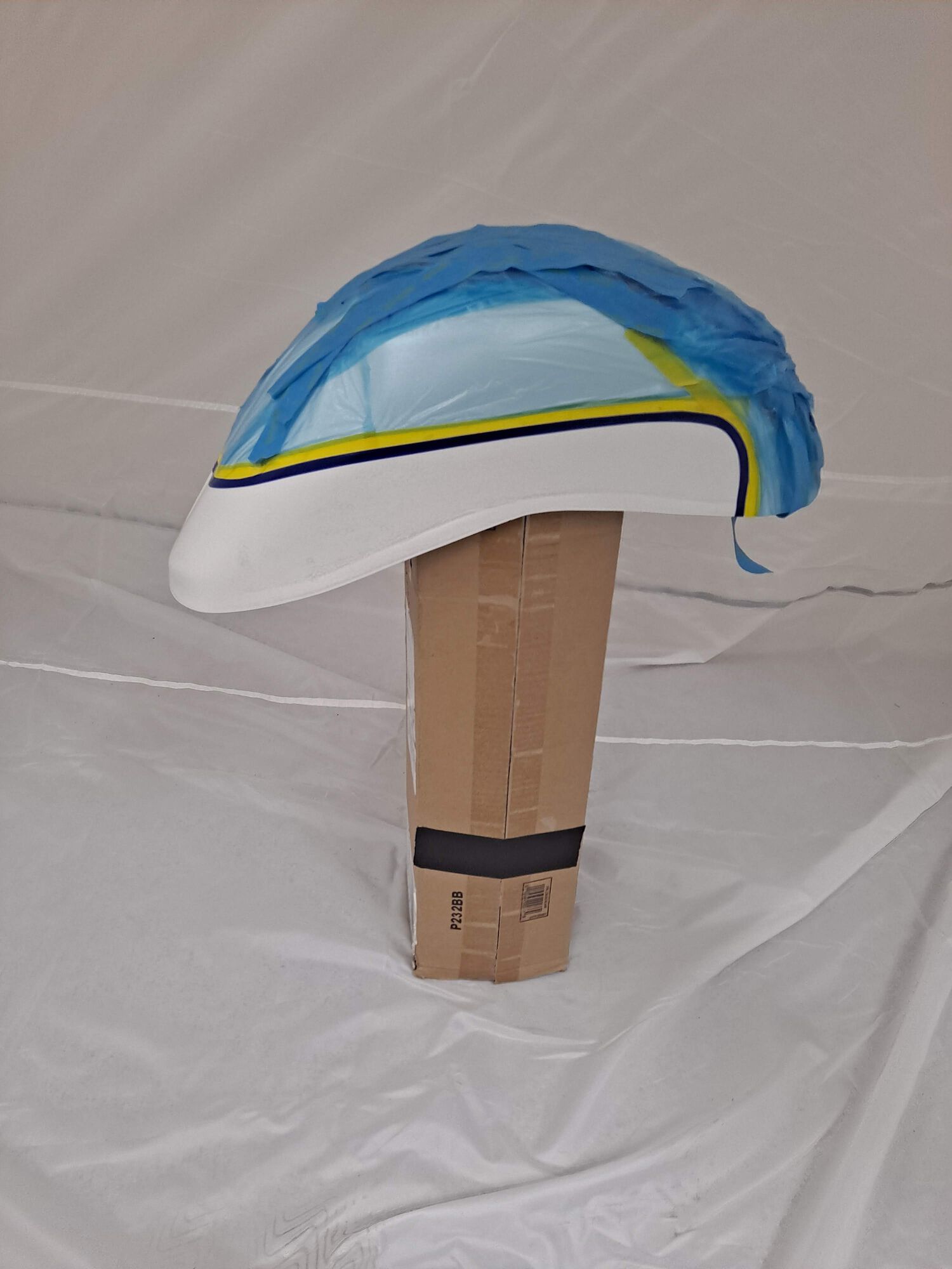 Sanded back all the clear coat and cleaned the mudguard well before masking off to add the green it was sorely lacking.