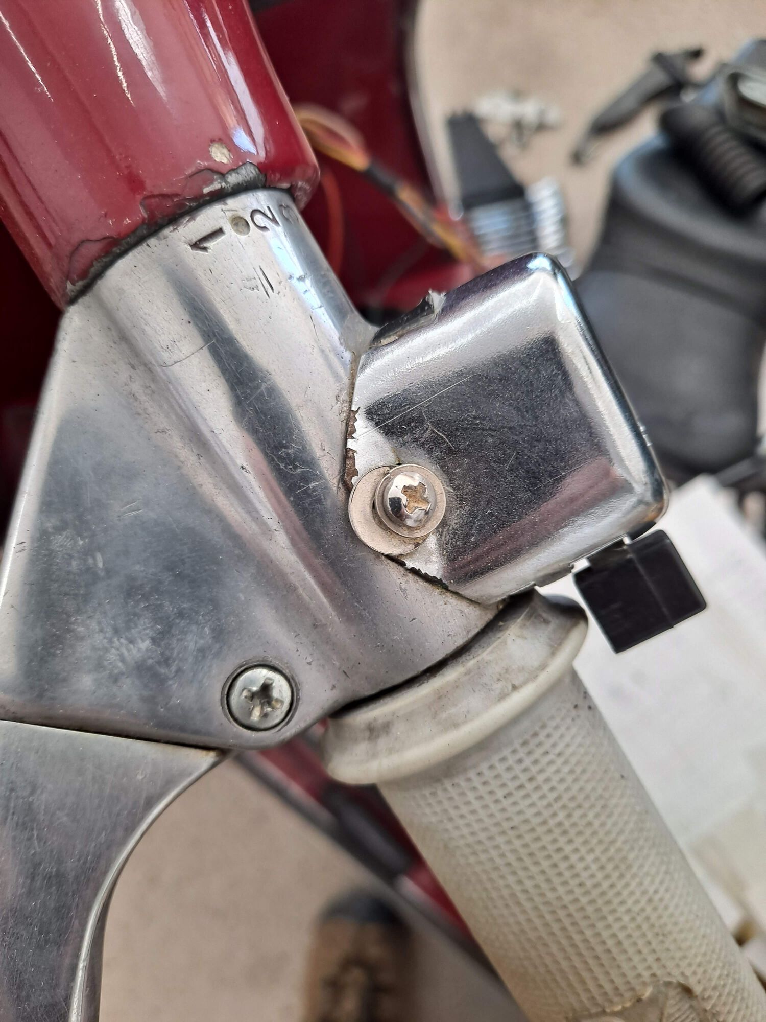 I couldn't find a decent turn signal switch back then, so this is a cheap substitute I was able to source, crudely screwed into the handlebar.